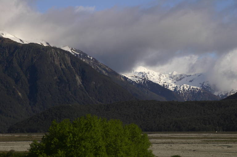 On the trail, snowy mountains in the distance