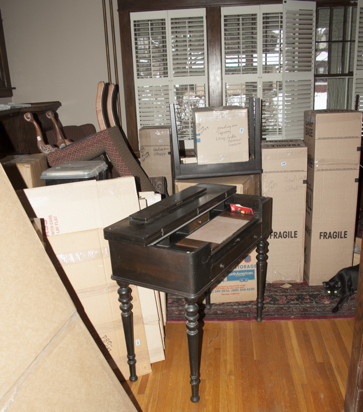 spinet desk amongst the boxes