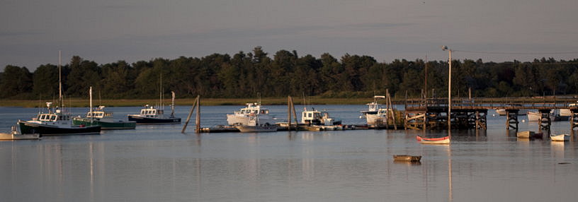 Dusk: small boats at high tide