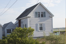 The cottage and its garage