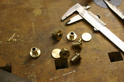 pieces of brass, esthetically turned