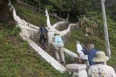 single file of walkers going up a long stone stair