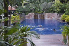 swimming pool with a few people in