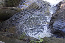 water falling over lingams