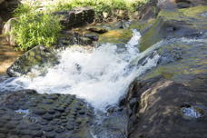 water falling over lingams