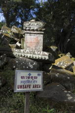 sign saying “unsafe area” in several languages