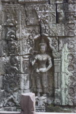 sculpture of a woman standing in a niche