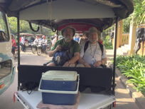 two men sitting in a surrey without fringe