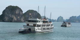 two ships in Ha Long Bay, with rocks