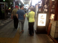 the others walking in the Asakusa market