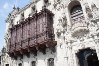 Wooden balcony on white building