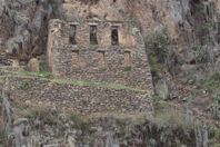 long-distance view of ruins with empty windows