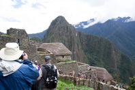 Mark looks out over scenery including tourists