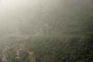 three men walking in dismal fog